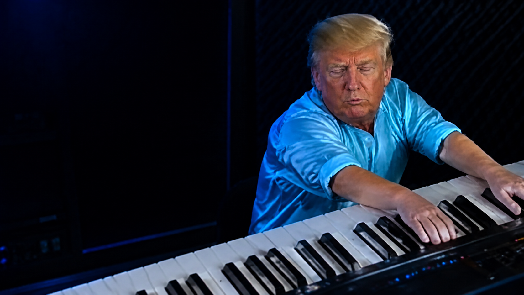 Keyboard Trump on a blue stage
